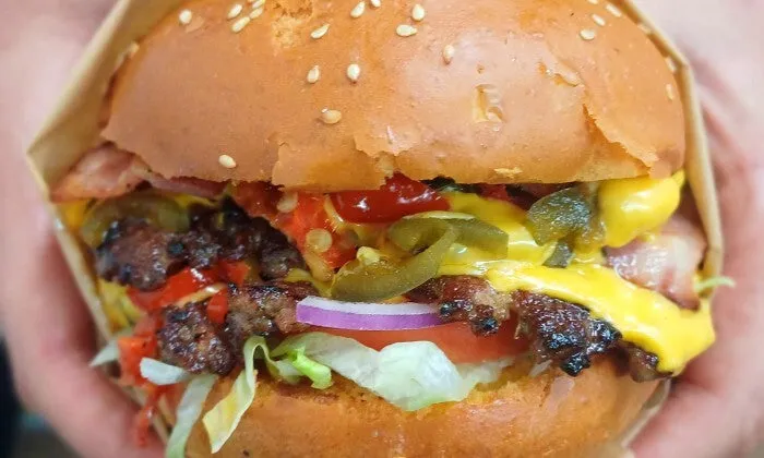 Choice of Any Burger with Side for 2, 4, or 6 at The Wing and Burger Bar